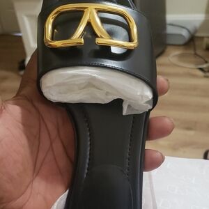 Valentino Garavani Black Sandals with Gold Logo